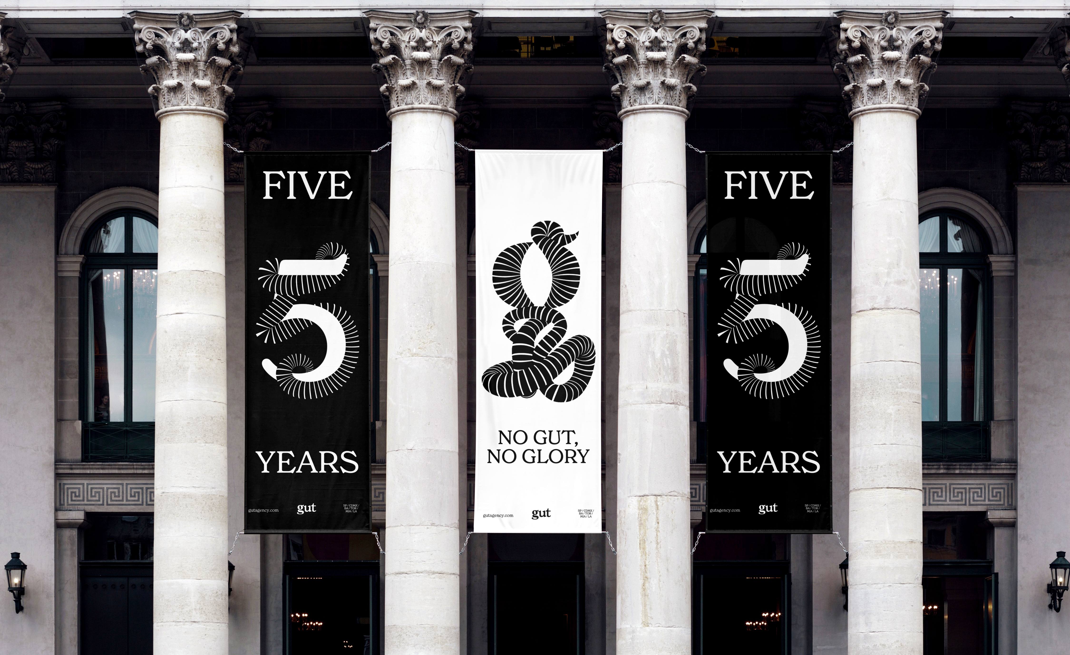 Branded banners between columns of a monumental building 