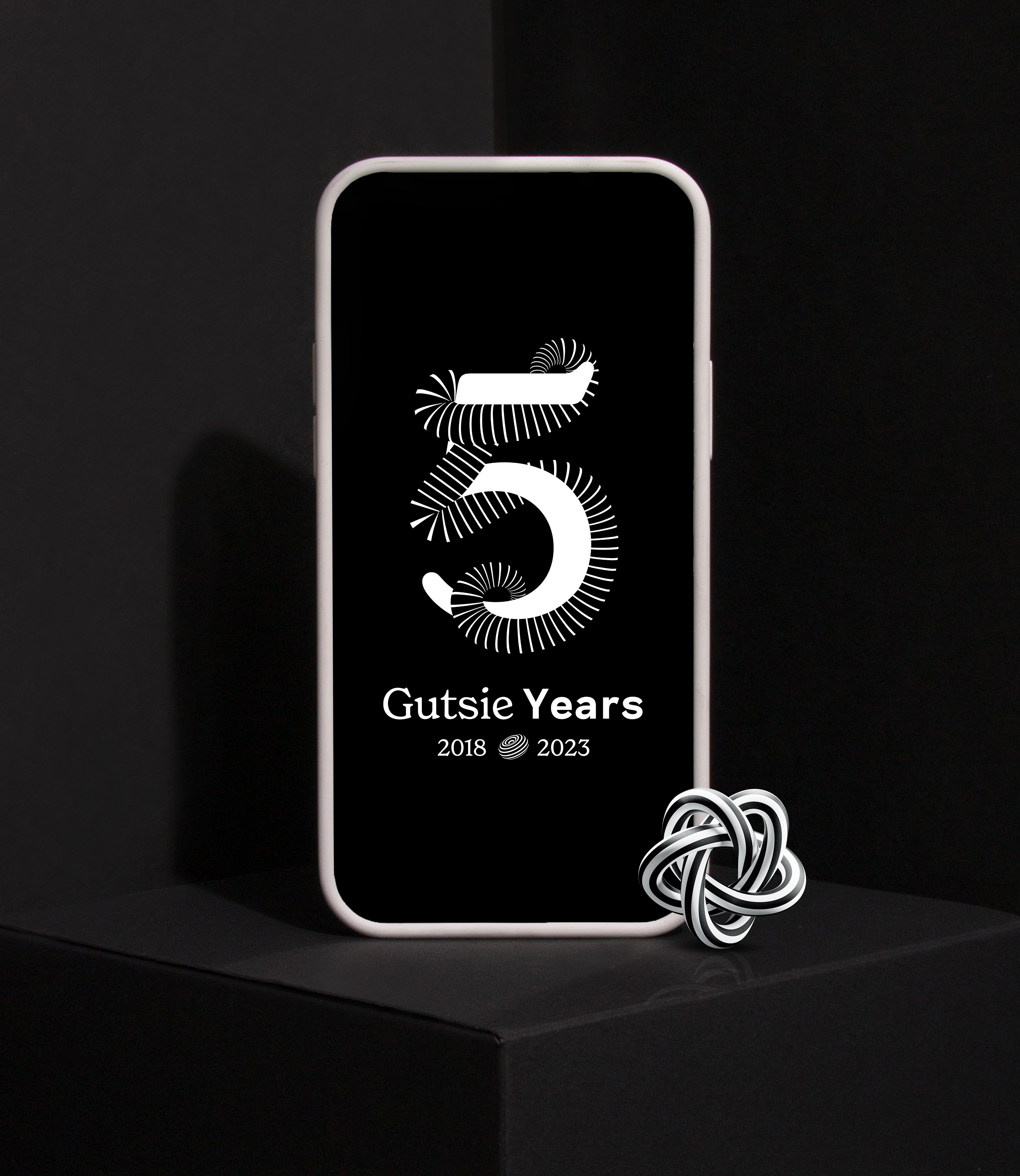 Smartphone with a graphic for the 5 years celebration