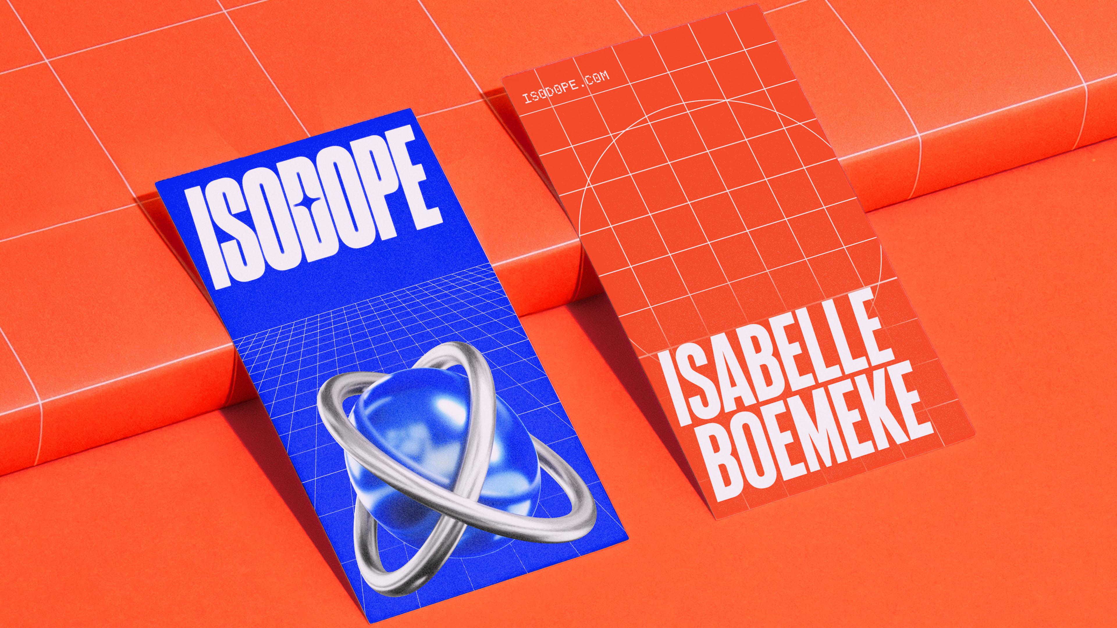 Stationery items on a orange grid surface