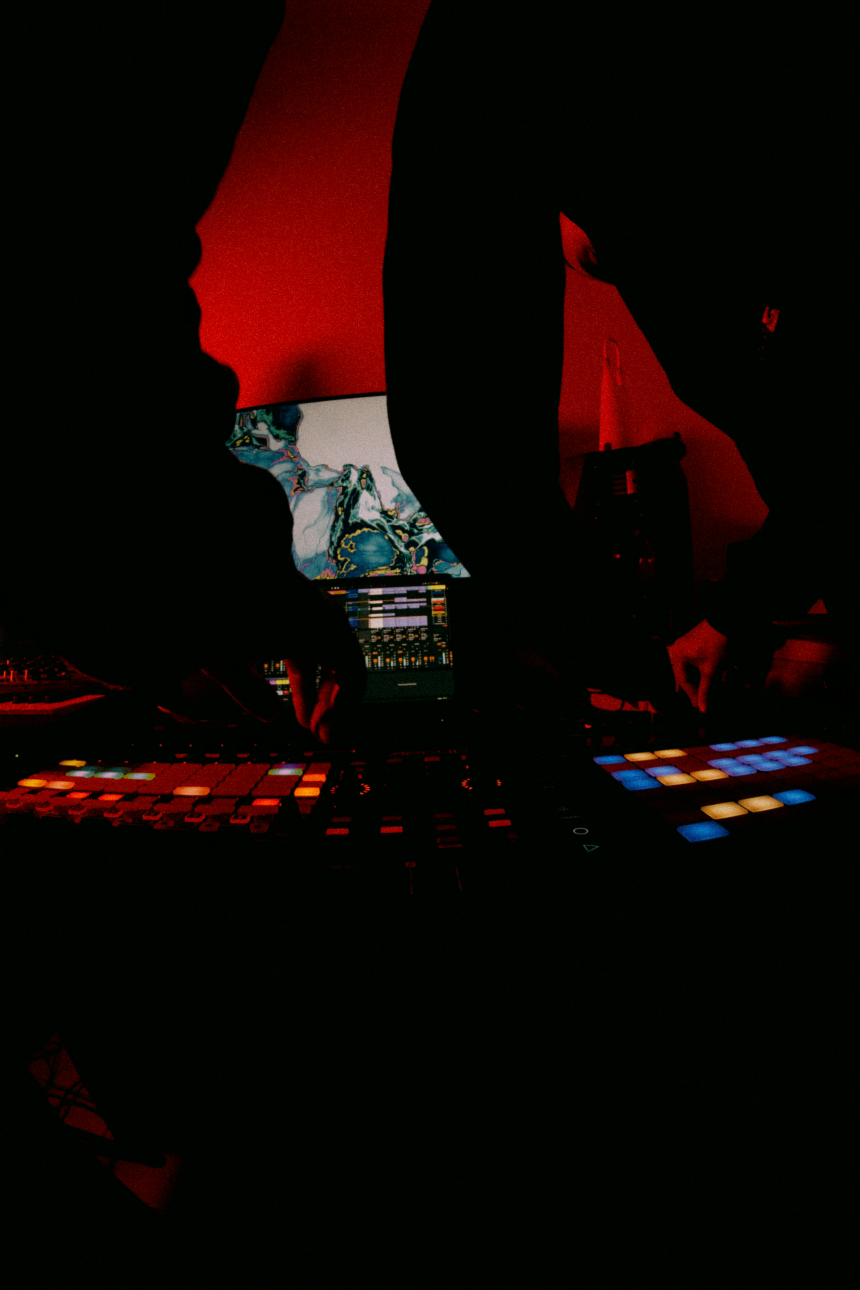 DJ set with the album cover on a monitor